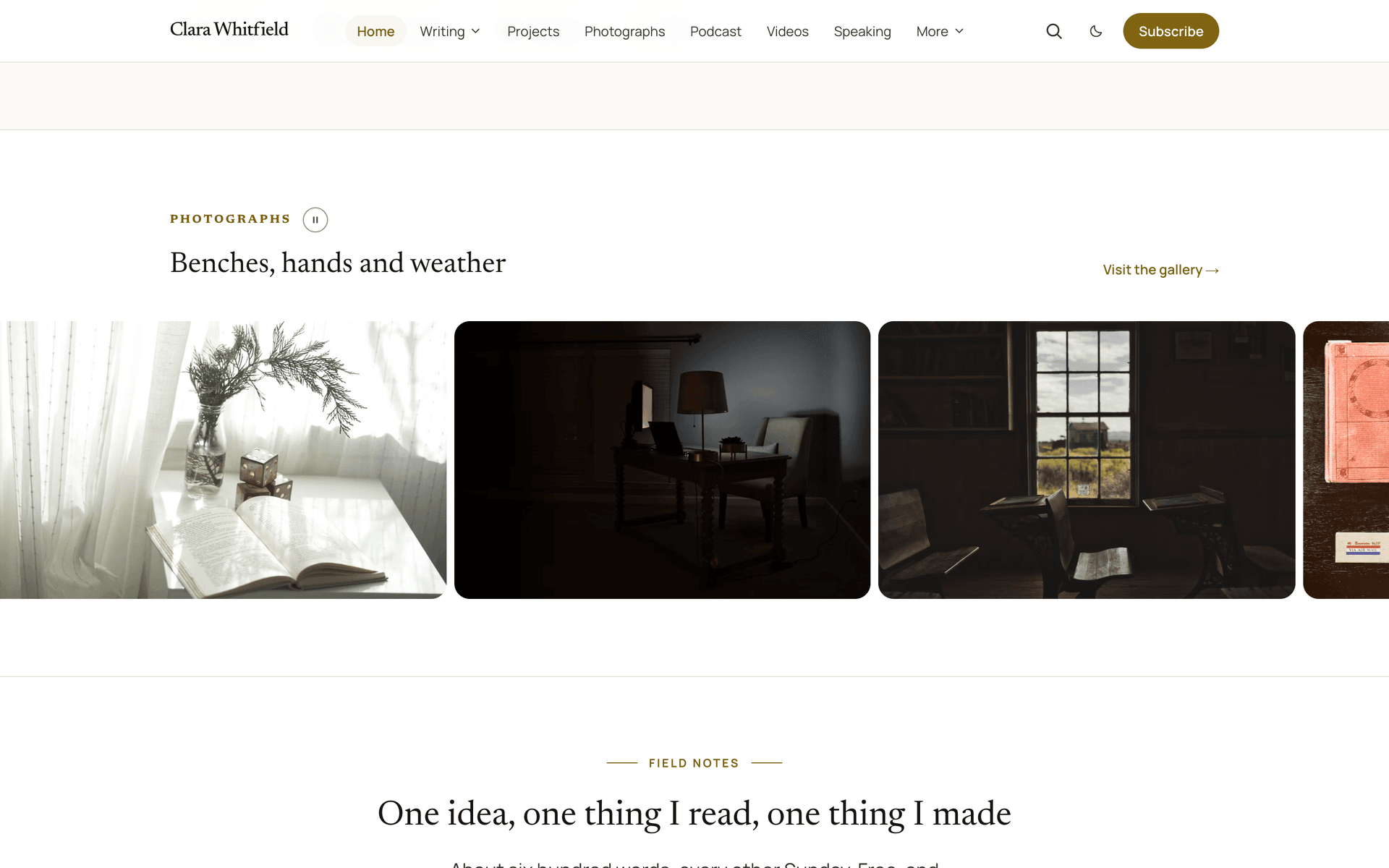 Quiet homepage photo strip running to both edges of the screen