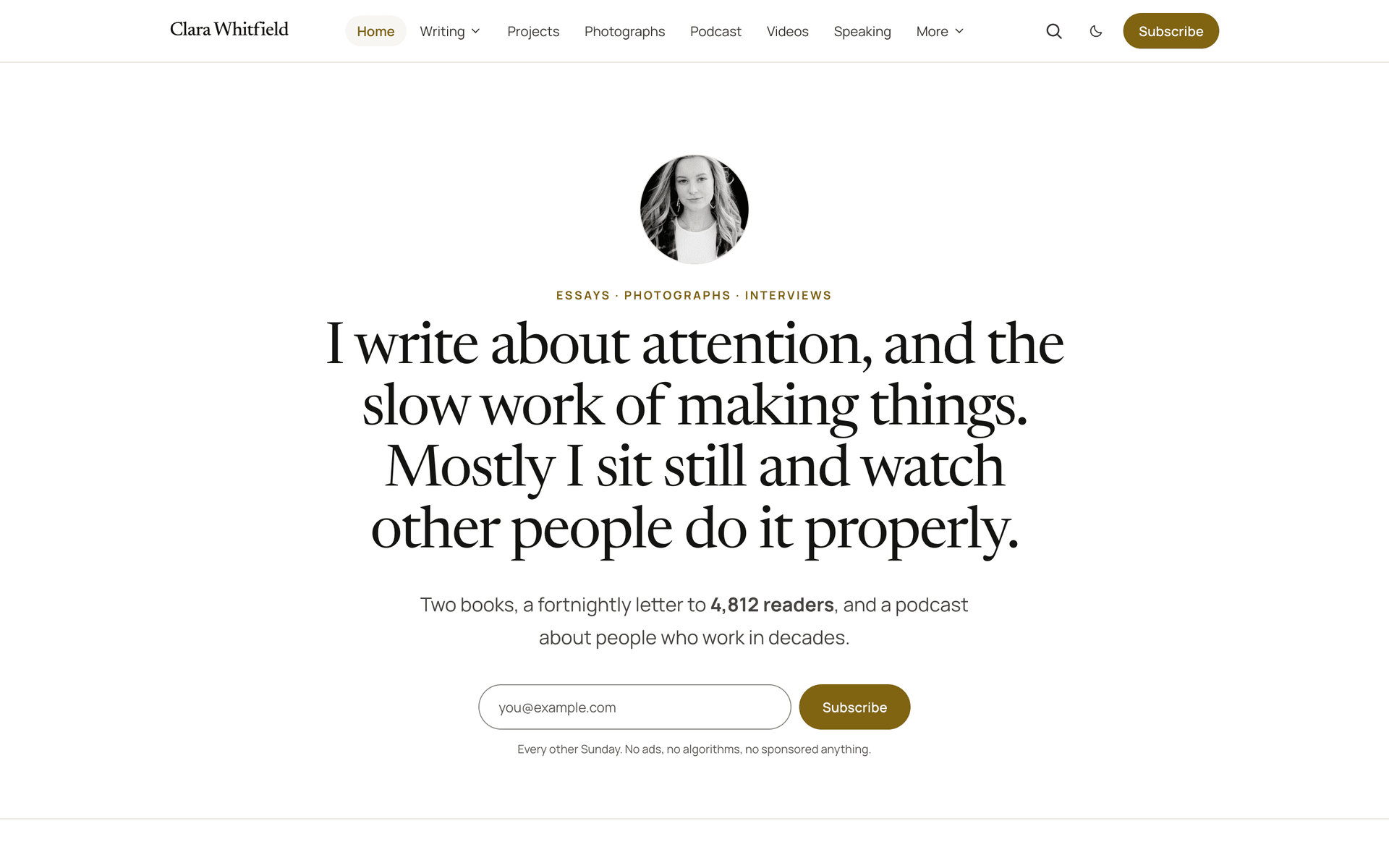 Quiet centred introduction with a round portrait above the headline and signup field